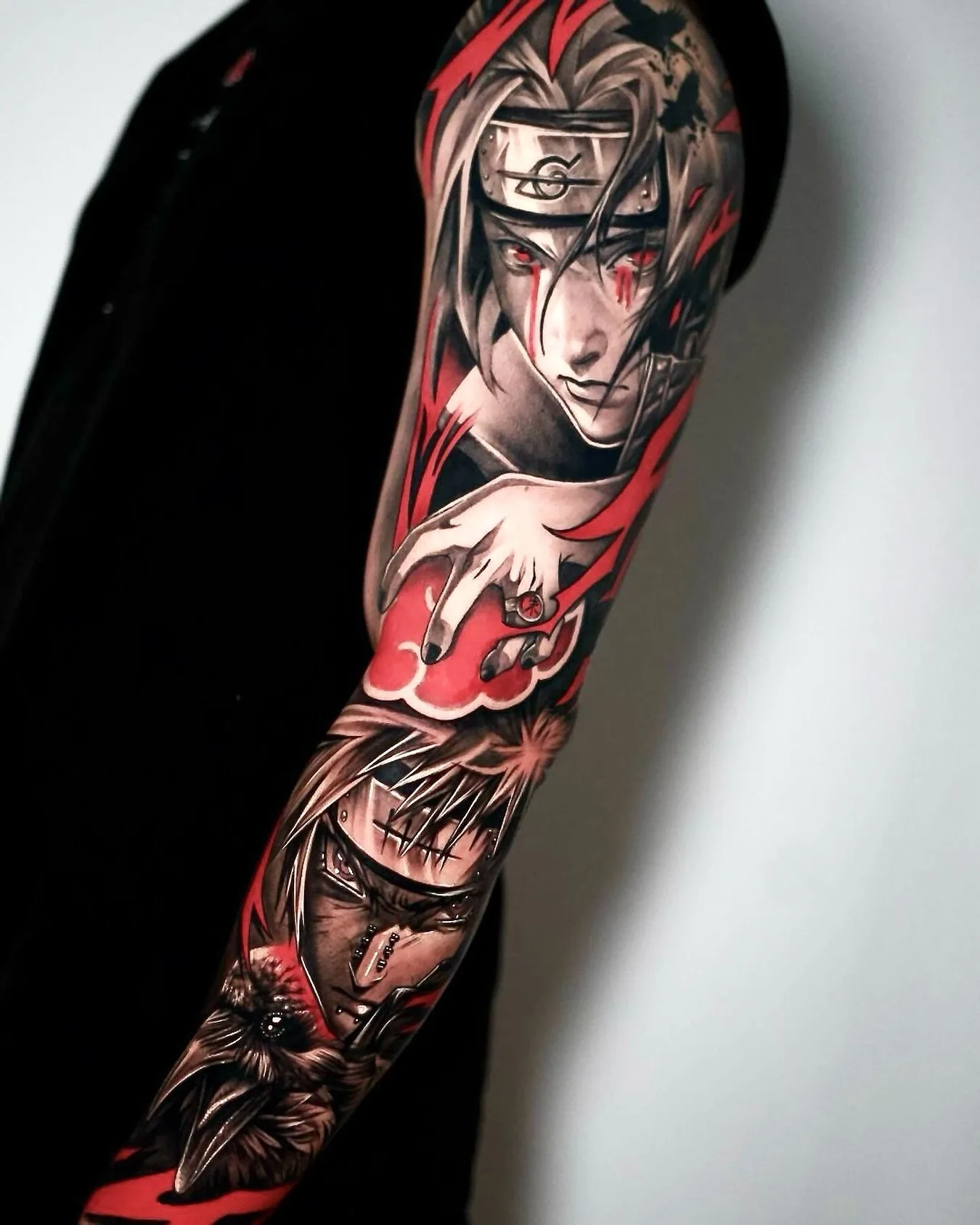 Anime Tattoo Sleeve in Rot und Black and Grey am Arm – Prime Ink Bremen